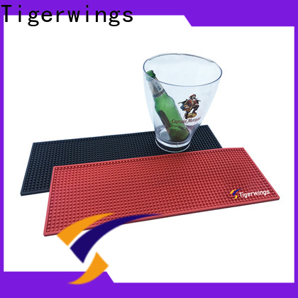 Fabricantes de tapetes Tigerwings Guinness para mantener limpia la barra